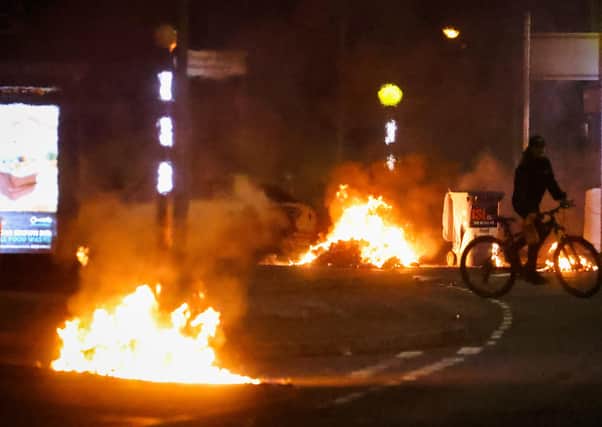 Cars burning at the Doagh Road roundabout of Newtownabbey in County Antrim on Saturday night. There was further trouble in Newtownabbey and Carrickferugs on Sunday night. 

Photo by Kelvin Boyes / Press Eye.