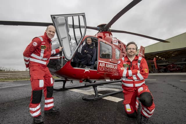 Pictured from left,  Dr Andrew Topping, Pilot Dave O'Toole and Paramedic David Marshall