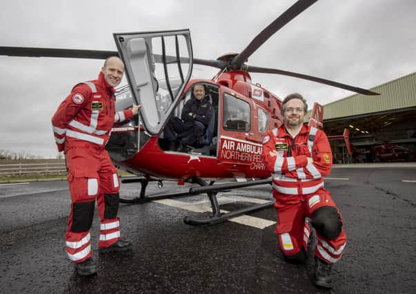 Pictured from left,  Dr Andrew Topping, Pilot Dave O'Toole and Paramedic David Marshall