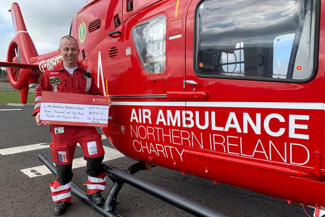Glenn O’Rorke lead paramedic with the NI Air Ambulance pictured with the donation made by AG staff.