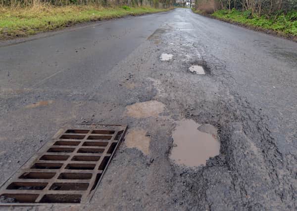 Some of the major potholes on Lisnisky Lane. INPT07-214.