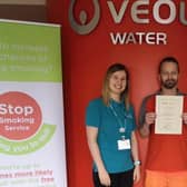 Lee Foster receives his stop smoking certificate from Trudy Barnes, Cancer Focus NI