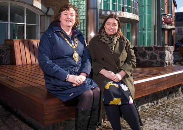At new seating outside Carrickfergus Museum and Civic Centre are the Mayor of Mid and East Antrim, Cllr Maureen Morrow and Communities Minister Deirdre Hargey
