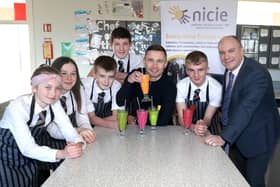 Carl Frampton with Glengormley High Principal Ricky Massey and some HE pupils who designed smoothies for Carl to try.