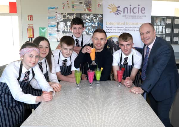 Carl Frampton with Glengormley High Principal Ricky Massey and some HE pupils who designed smoothies for Carl to try.