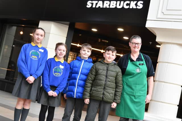 Pupils from Camphill Primary School in Ballymena, pictured with Sandra Williams, Starbucks Store Manager and Chair of Fairhill Trader’s Association during Fairhill Shopping Centre’s Stepping Stones event.