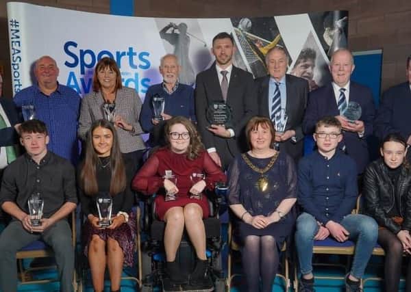 Gareth McAuley ( back row, centre), and fellow award winners with the Mayor, Cllr Maureen Morrow, at Larne Leisure Centre.