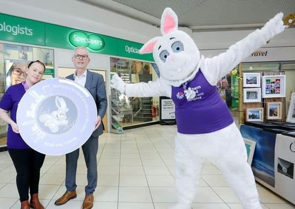 Kirsten Seller, Events Intern at Northern Ireland Children’s Hospice, Tony McGinn, Optometry Director at Specsavers, and the Children’s Hospice Bunny promote this year’s 5k Rabbit Run and 1 Mile Bunny Hop event,  backed by Specsavers, Abbeycentre,
