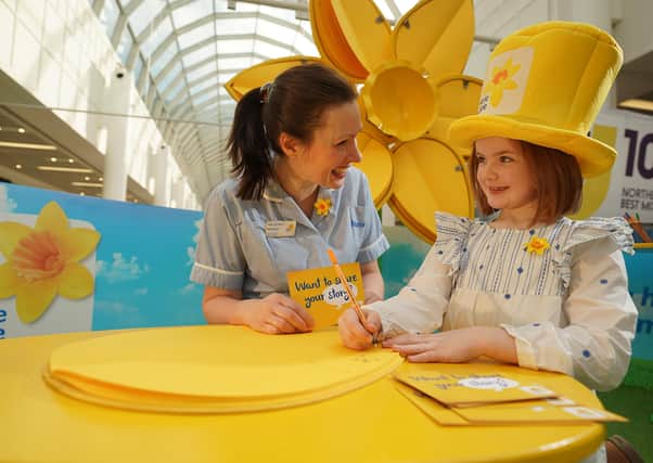 Nurse Rosemary Russell with Marie Curie fundraiser, 7 year old Emily McCooey