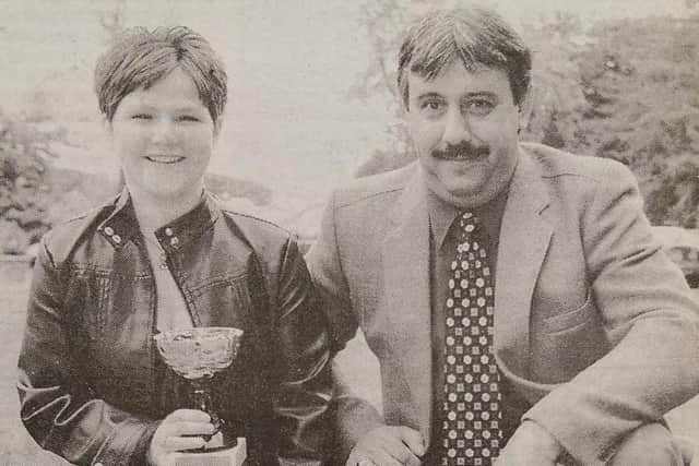 Lorraine Wharry of the Halfway House and Dessie Gray of Clough Blues with the trophies that they received at the Darts League Dinner.
2000