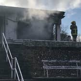 Firefighters finish putting out the latest fire at Sion CC's Clubhouse.