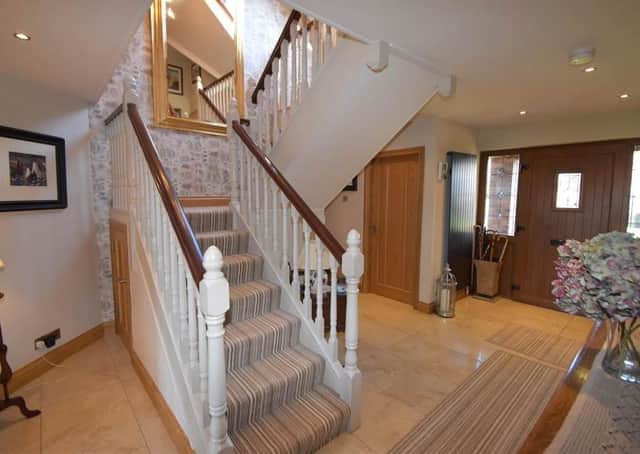 The entrance hall with turning staircase leading to first floor