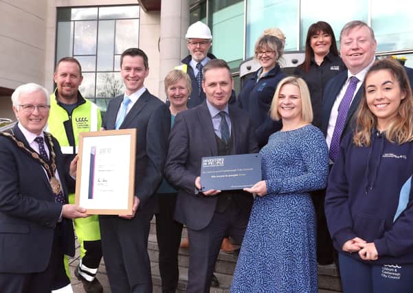 Pictured receiving the council's Silver Investors in People (IIP) Accreditation from Eddie Salmon, IIP assessor are: (front l-r) Mayor Councillor Alan Givan; Clifford Ferguson; David Burns, Chief Executive; Diana Stewart; Caroline Magee, Head of HR & OD; Alderman Paul Porter, Vice-Chair of the council's Corporate Services Committee and Amy Seawright.
(back l-r) Sean McConville; Emma Breadon and Paula Fay.