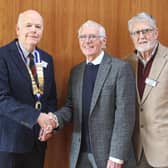 President Derick Woods greets Frank Rodgers with club member Reggie Patterson (R) and Club Vice President John McKegney (L)