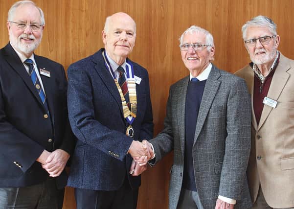President Derick Woods greets Frank Rodgers with club member Reggie Patterson (R) and Club Vice President John McKegney (L)