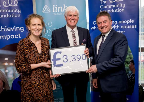 Stanley Abraham, Director of Links Counselling Lurgan (centre) pictured with Síofra Healy, Director of Philanthropy at the Community Foundation for Northern Ireland and Gordon Milligan, Chair of the Institute of Directors