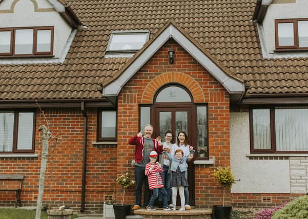 The Lowry family outside their home in Jordanstown