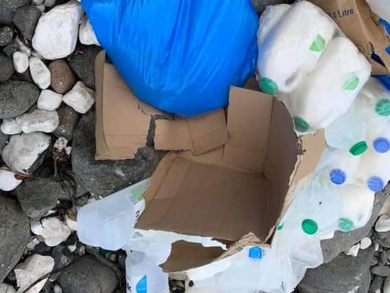 Unopened milk cartons were dumped on the east Antrim shoreline.