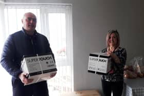 Pictured receiving the delivery of the gloves is Liz Warwick, Acting Team Leader at Trostan Avenue Hostel from Alan Barr, Freemason from the Seven Towers and Masserene District charity Committee.