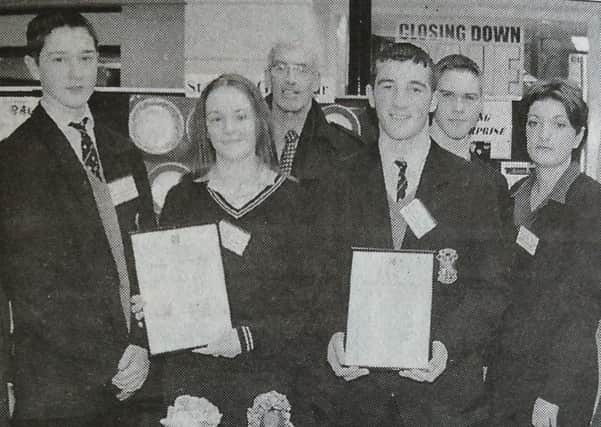 Students of St Louis Grammar whose Bags n' Rags Company won Best Overall award and Best Overall Display award at the Young Enterprise Exhibition. Included is the Mayor, Cllr James Currie (left) and John Stuart, St Louis principal (centre). 
2000