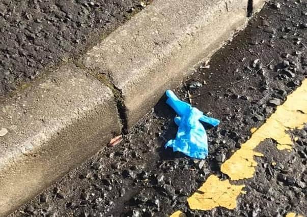 A latex glove discarded at the roadside in Larne.