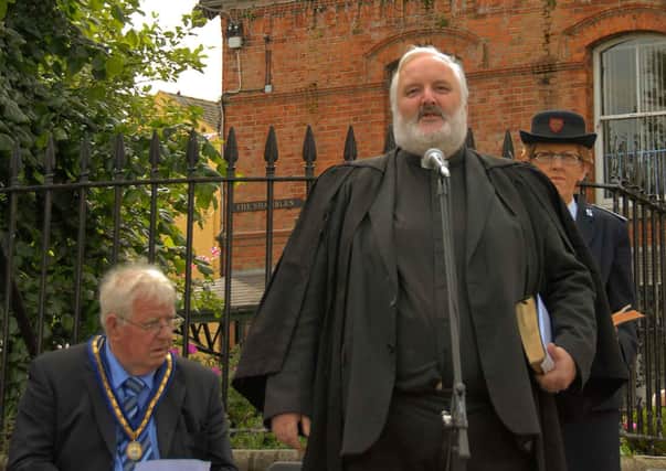 Rev Ivan McKnight leading the service to unveil and dedicate additional names on Dromore war memorial in June 2007.
