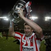 Peter Hutton holding aloft the FAI Cup after Derry City's memorable win over St Patrick's Athletic.