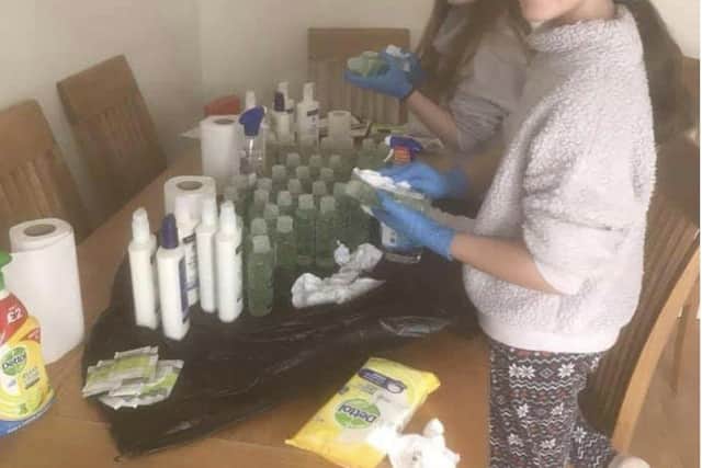 Dawn Baxter's daughters Megan and Jessica disinfecting the PPE purchased from an array of suppliers before delivering it to local hospitals