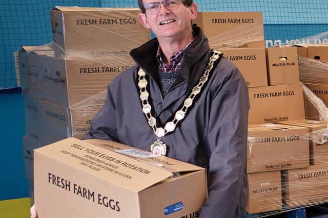 Mid Ulster Council Chairperson Counillor Martin Kearney helping at the emergency distribution centre.