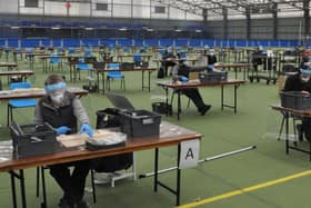 Busy producing face shields at their workstations in Meadowbank Sports Arena.