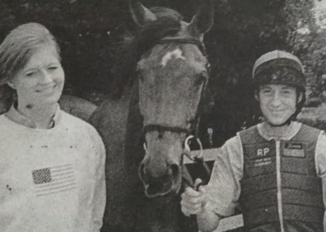 Noel Roche is presented with his NVQ certificate for Horse Care at  Patton's stables in Ballycarry by Wesley Magowan of Joblink Braid as tutor Anne Marie Martin looks on.1999