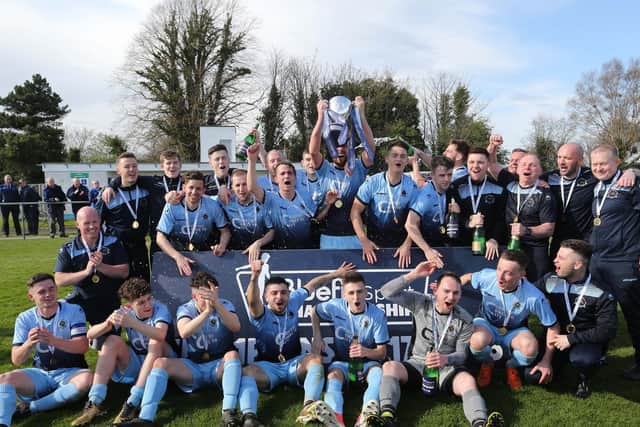 Eamonn Seydak and his Institute team-mates celebrate their memorable Bluefin Sport Championship victory in 2018.