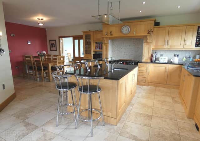 The property features a large kitchen/dinette/living room