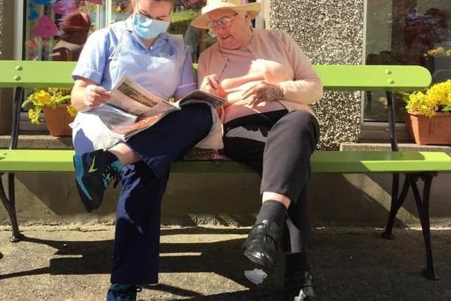 Ray and Katie enjoy reading a magazine together.