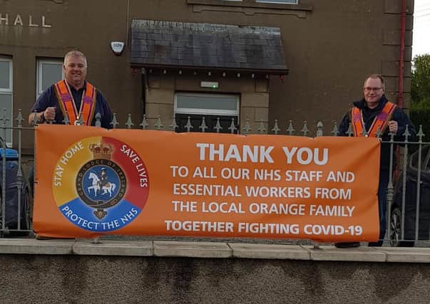Lower Iveagh District No1, WDM John Wilkinson and DDM Gavin Beck with the new GOLI banner @ Dromore Orange Hall supporting the NHS.