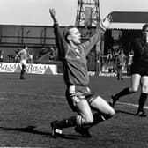 Stevie Cowan, in possibly the most iconic image within Portadown club history, is captured dropping to his knees in celebration at the final whistle of the Irish Cup victory over Glenavon in 1991. Cowan's brace secured a landmark league-and-cup trophy double for the Ports.