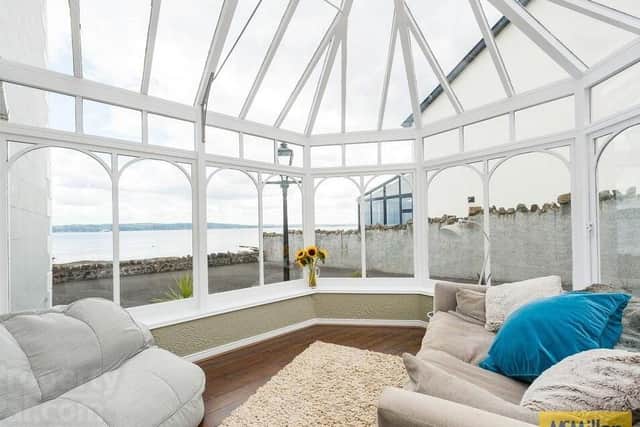 The conservatory has magnificent views of Belfast Lough towards the County Down coastline