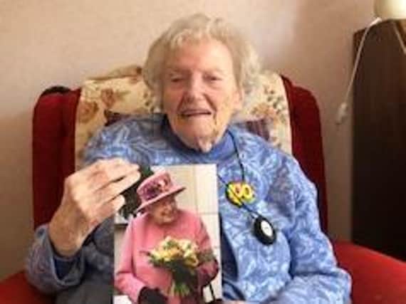 Olive Clarke with her birthday card from the Queen.