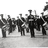 Killymoon Conservative Band at the Cookstown Victory Parade in 1945: Front row: Robert Hamilton, Tommy Campbell, Bill Moore (Drum Major), Jim Anderson, William Mullan and Alvin Mullan (young lad). Second row: Jim Larmour, John Mallon, Tom Patterson Third Row: Hugh Davidson, Jim Davidson, Jim Wylie, Fred Mallon.