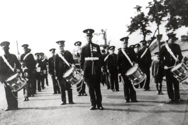 Killymoon Conservative Band at the Cookstown Victory Parade in 1945: Front row: Robert Hamilton, Tommy Campbell, Bill Moore (Drum Major), Jim Anderson, William Mullan and Alvin Mullan (young lad). Second row: Jim Larmour, John Mallon, Tom Patterson Third Row: Hugh Davidson, Jim Davidson, Jim Wylie, Fred Mallon.