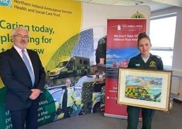Emma presented Michael Bloomfield with a framed print to be kept on display in the NIAS reception area.