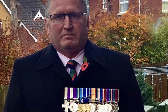 Doug Beattie MC MLA on Remembrance Sunday November 10 2019. Taken from his twitter feed on that day, when he says he is between services