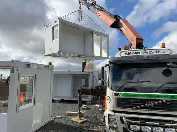Supplying a mobile building at a hospital site.