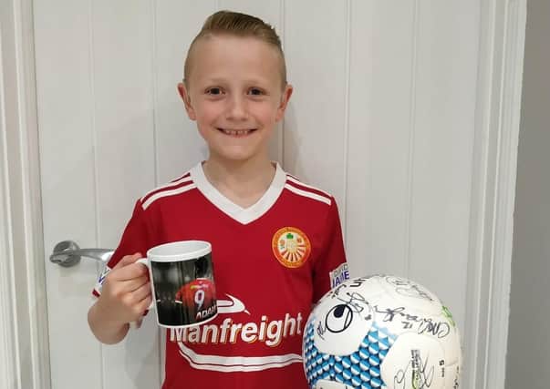 Nine-year-old Portadown Tom Kerr with his special gifts.