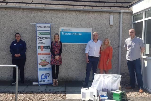 Clarke and Holly handing over PPE at Trasna House in Lurgan accompanied by local MLA Carla Lockhart