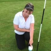 Jennie Flanagan points to her first ever 'hole in one' success, which she did at Prehen, on Wednesday.