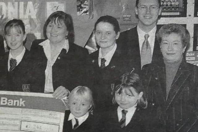Representatives of the Ballymena Acadmey 1999 charity committee present Sylvia Crossey of the Prep Dept. with a cheque for Mencap. Included is Mr A. Brown, charity co-ordinator,  and member of staff.
2000