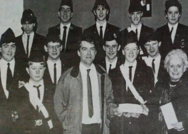 Tom McDowell and Margaret McCartney receive a cheque on behalf of the Tower House Fund from members of Second Ballymena BB. Making the presentation is Lee Eagleson.1989