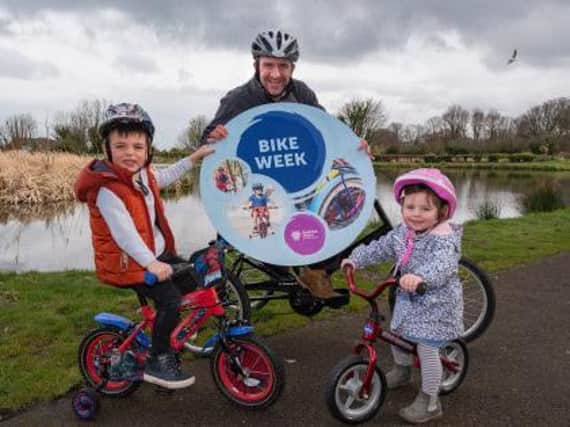 The Picken Family: dad Glenn and little Harry and Erin are all geared up for #BikeWeekMEA