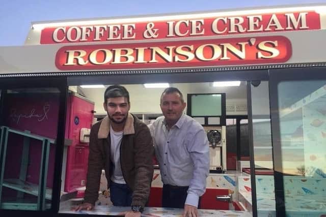 James and his father Jimmy Robinson in one of their ice-cream vans.